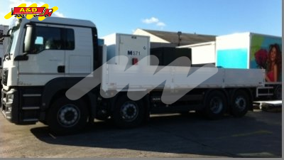 Flat bed with drop-side